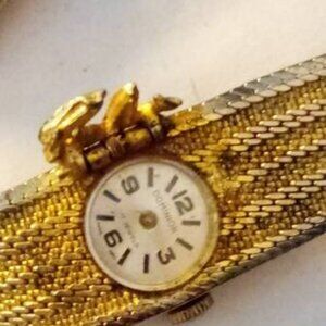 Dominion Swiss made watch golden stainless steel back with black dials? 17 Jewel